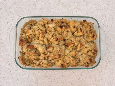 Golden baked turkey dressing in a glass baking dish